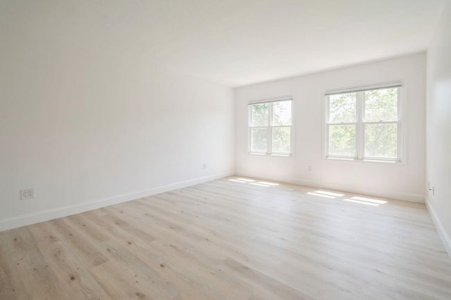 Spare room featuring light wood-style flooring and baseboards | Image 10