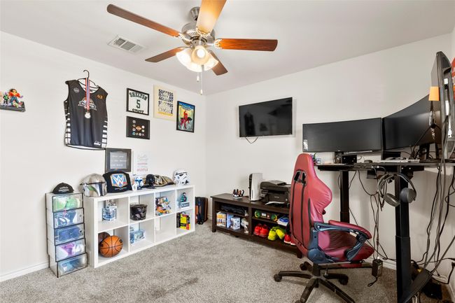 Office with a ceiling fan, visible vents, and carpet | Image 28