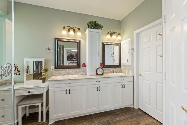 Bathroom with double vanity and wood finish floors | Image 25