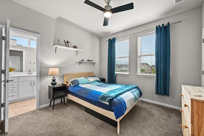 The guest bedrooms offer plenty of space, perfect for family, friends, or a home office, with ample closet space and large windows that bring in natural light | Image 21
