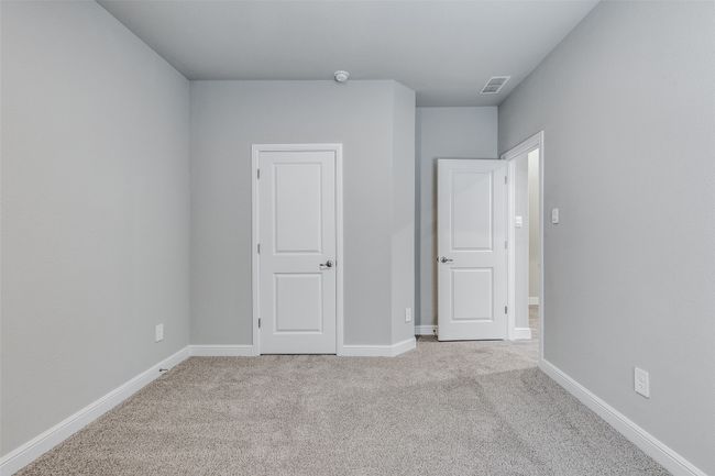 Unfurnished bedroom featuring light carpet | Image 15