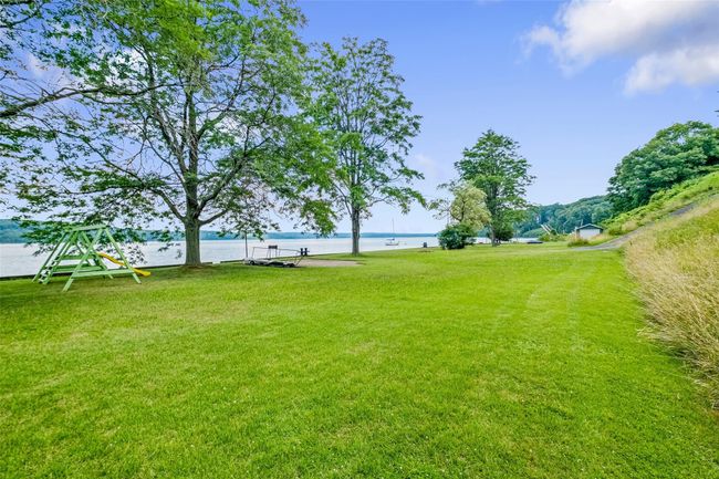 View of grassy yard with a water view | Image 35