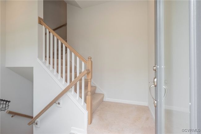 Staircase featuring carpet floors and baseboards | Image 25
