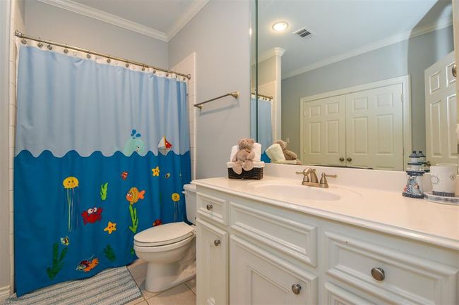 Secondary bathroom features modern fixtures and a clean, classic design | Image 22