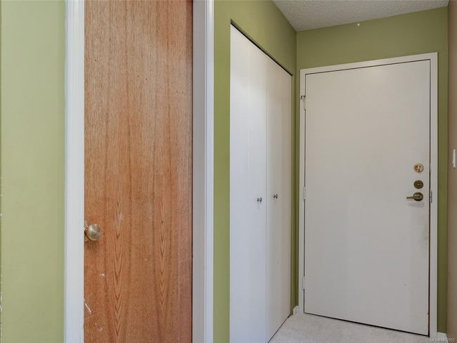Hallway featuring a textured ceiling | Image 18