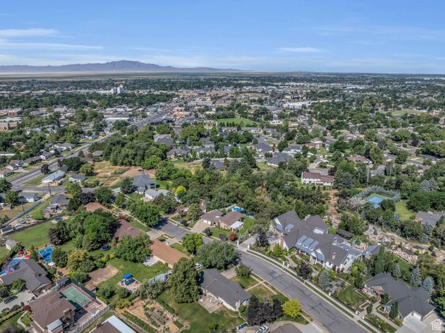 Aerial overview of property's location featuring mountains and nearby suburban area | Image 47