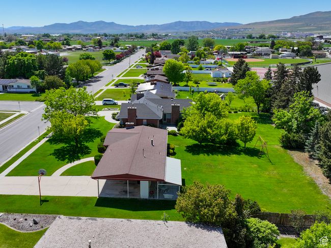 Aerial view of residential area featuring a mountainous background | Image 6