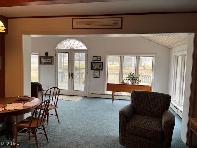 Living area open into sun room and plenty of natural light | Image 10