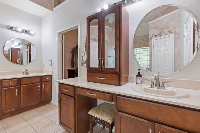 Full bath with tile patterned floors and two vanities | Image 27