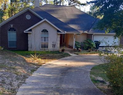 View of front facade featuring a garage | Image 1