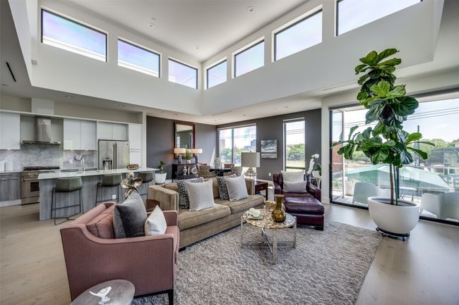 Living area with light wood-type flooring | Image 7