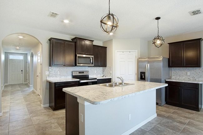 1672 Sw Bascom Ave, House other with 4 bedrooms, 2 bathrooms and null parking in Port Saint Lucie FL | Image 4
