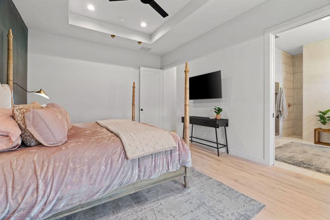 Bedroom with wood finished floors, recessed lighting, ensuite bathroom, and ceiling fan | Image 25