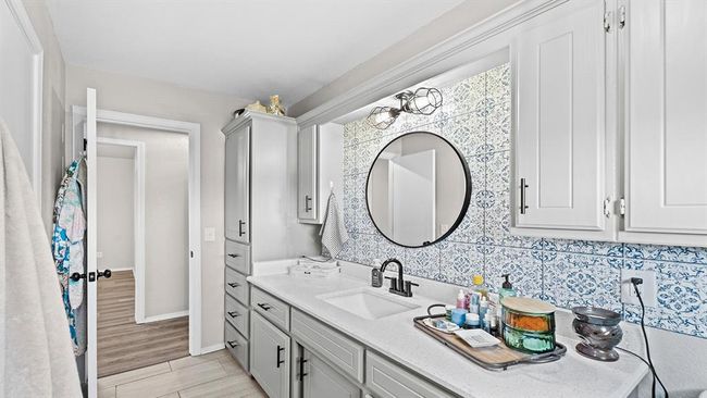 Bathroom featuring vanity and baseboards | Image 46