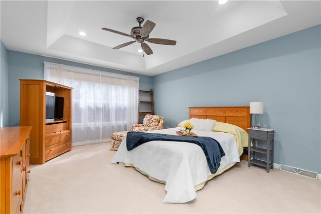 1st floor primary bedroom with tray ceiling | Image 15
