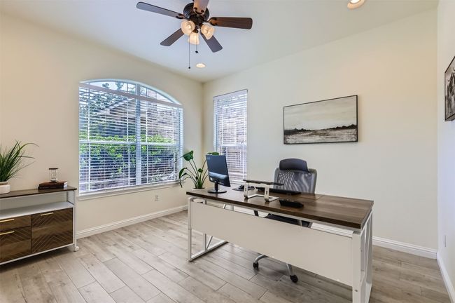 Private home office with front-facing window and natural light. | Image 4
