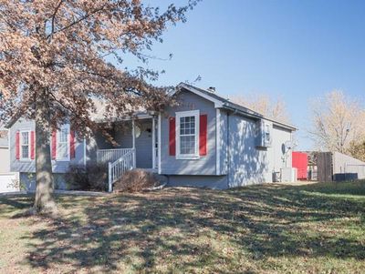 View of front facade featuring a front yard and a porch | Image 3