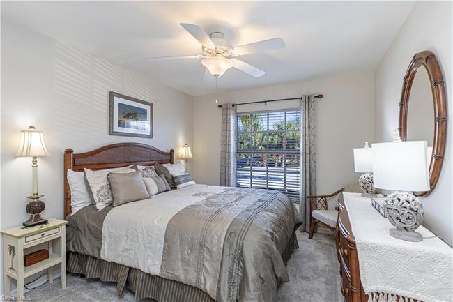 Carpeted bedroom with ceiling fan | Image 17