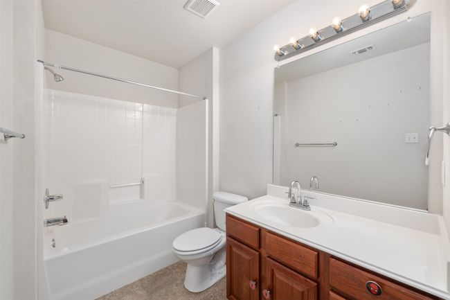 Full bathroom with shower / bathing tub combination, toilet, and vanity | Image 16