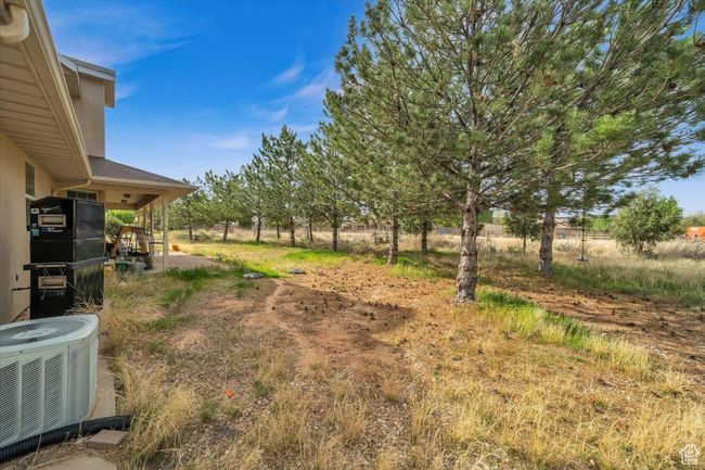 View of yard with central AC | Image 4