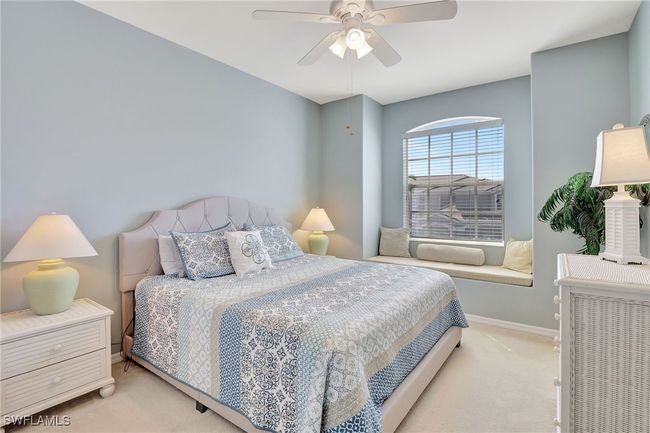 Bedroom featuring light carpet, baseboards, and a ceiling fan | Image 29