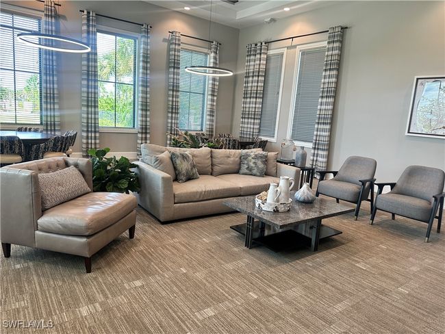 Community Amenities living room featuring a chandelier | Image 47