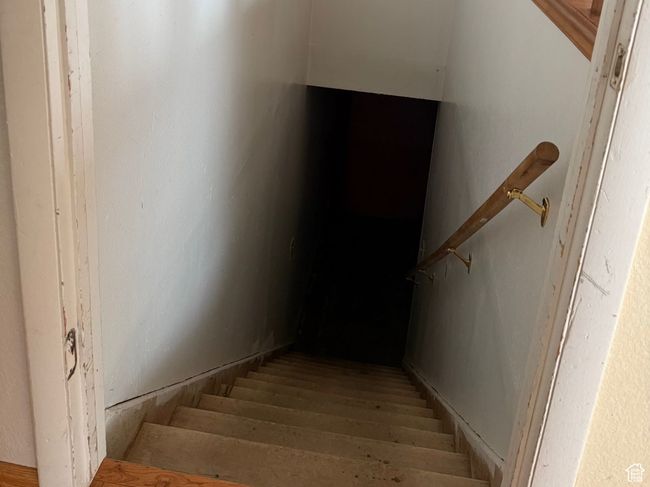 Staircase featuring wood finished floors | Image 20