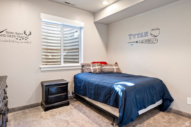 Carpeted bedroom with baseboards and visible vents | Image 40