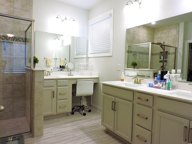 Bathroom with a stall shower and double vanity | Image 21