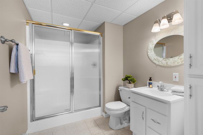 Basement level full bath with linen cabinet | Image 30