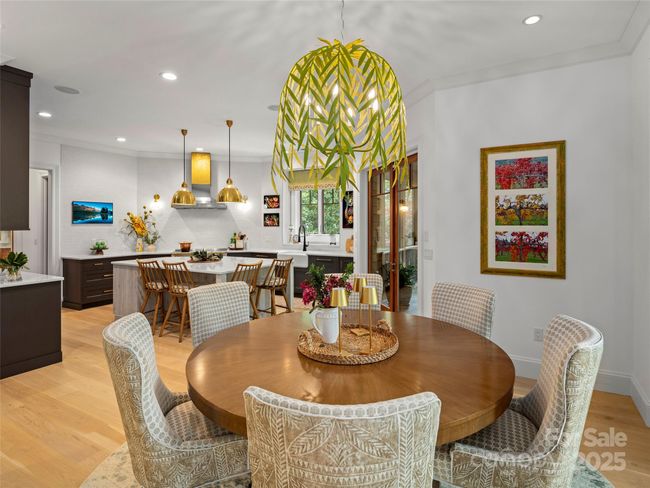 Dining area looking into kitchen. | Image 12
