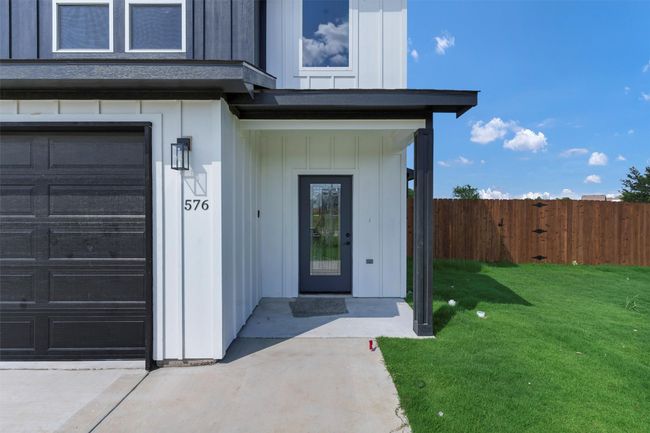 Property entrance featuring board and batten siding | Image 4