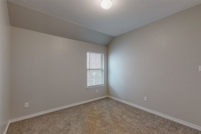 Empty room featuring lofted ceiling, carpet, and baseboards | Image 28