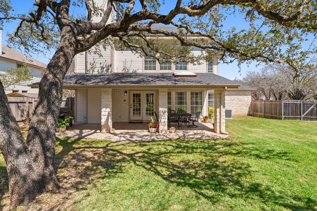 Rear view of house with a patio, a yard, french doors, a shingled roof, and fence private yard | Image 36