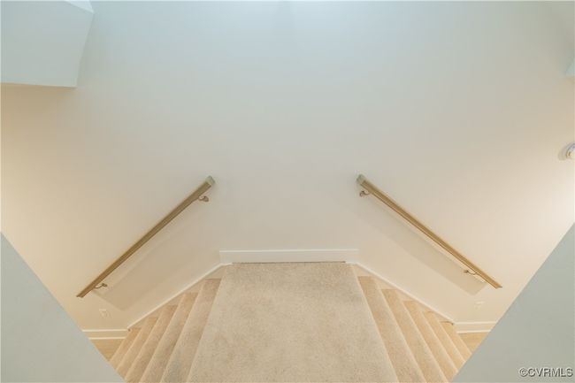 Stairs with carpet and baseboards | Image 7