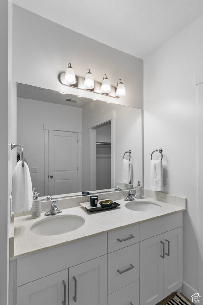 Full bath with double vanity, visible vents, and a sink | Image 12