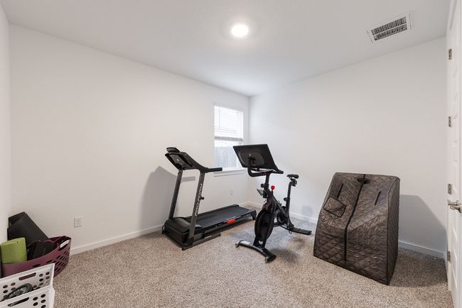 Workout area with visible vents, baseboards, and carpet floors | Image 25