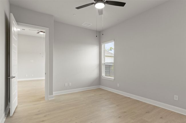 Unfurnished room with light wood finished floors and ceiling fan | Image 25