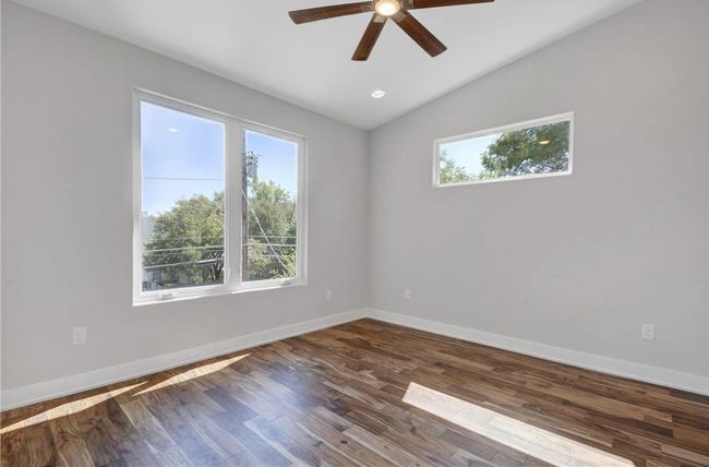 Spare room with a ceiling fan, baseboards, and a healthy amount of sunlight | Image 22