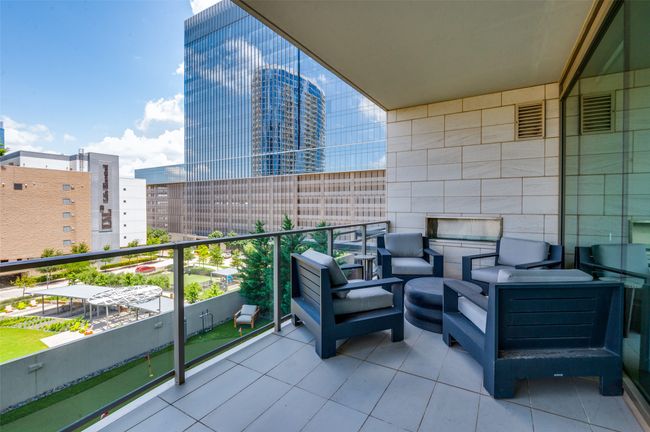 Balcony with a city view and an outdoor living space | Image 26