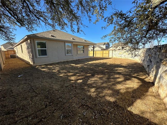 Back of property featuring a fenced backyard and roof with shingles | Image 28