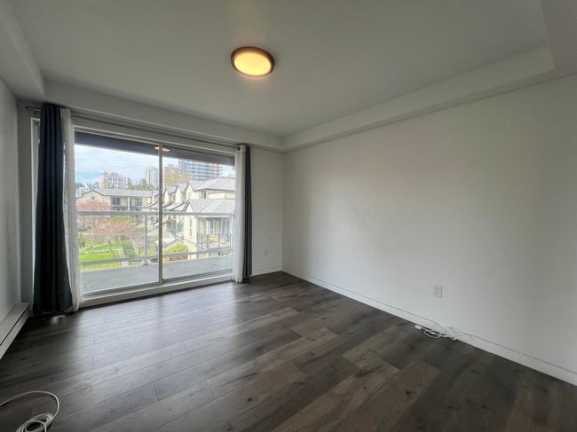 Spare room featuring dark wood-style floors | Image 23