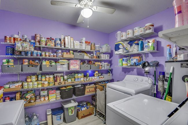 Enormous laundry - utility roon with an impressive amount of storage space. | Image 22