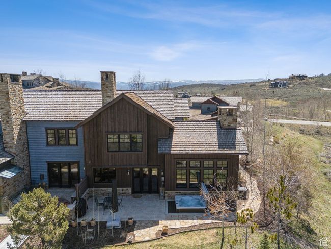 Back of property with a patio area, french doors, and a chimney | Image 39