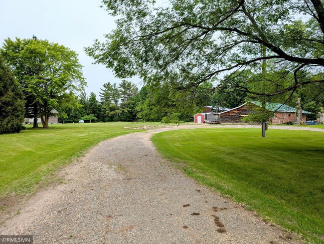 Driveway splits to home and to the sheds | Image 55