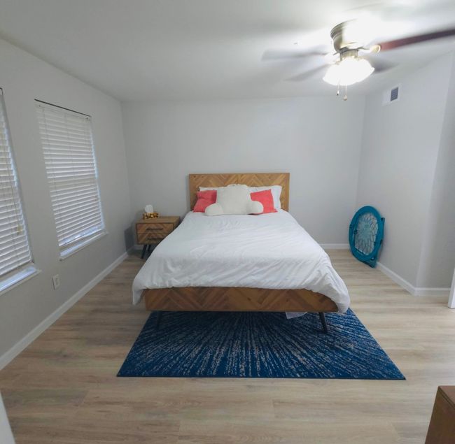 Bedroom 4, Guest or in-law suite featuring light wood-style flooring and ceiling fan | Image 25
