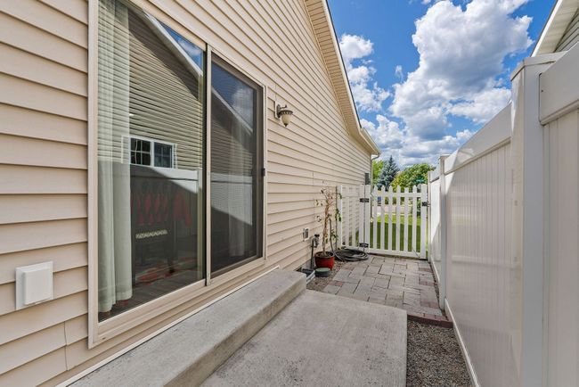 North side of the home with additional entry door for access to back yard. | Image 15