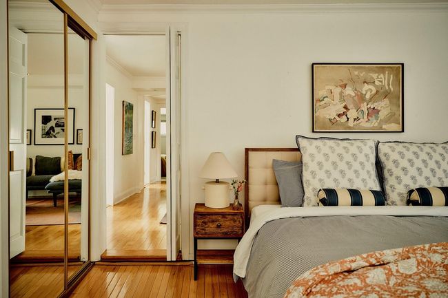 Bedroom with hardwood / wood-style floors, ornamental molding, and a closet | Image 19