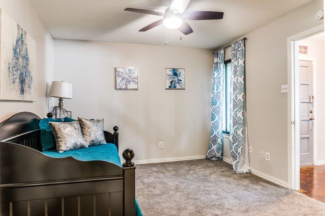 Carpeted bedroom with baseboards and ceiling fan | Image 6