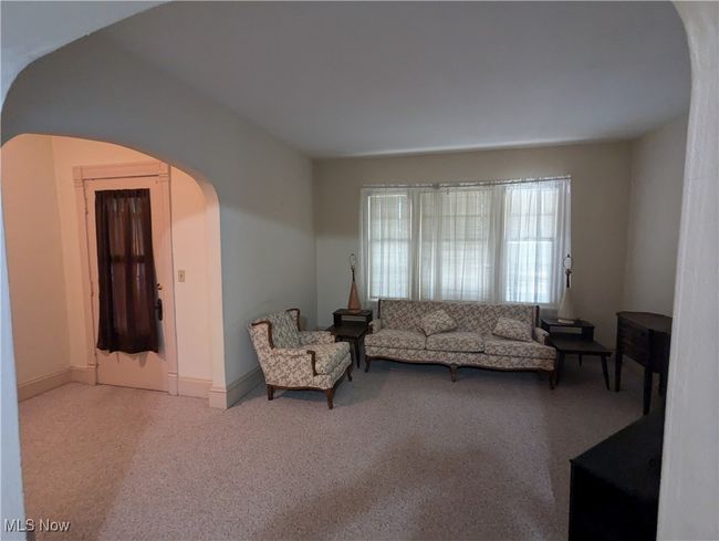 First-Floor View of carpeted living room | Image 5